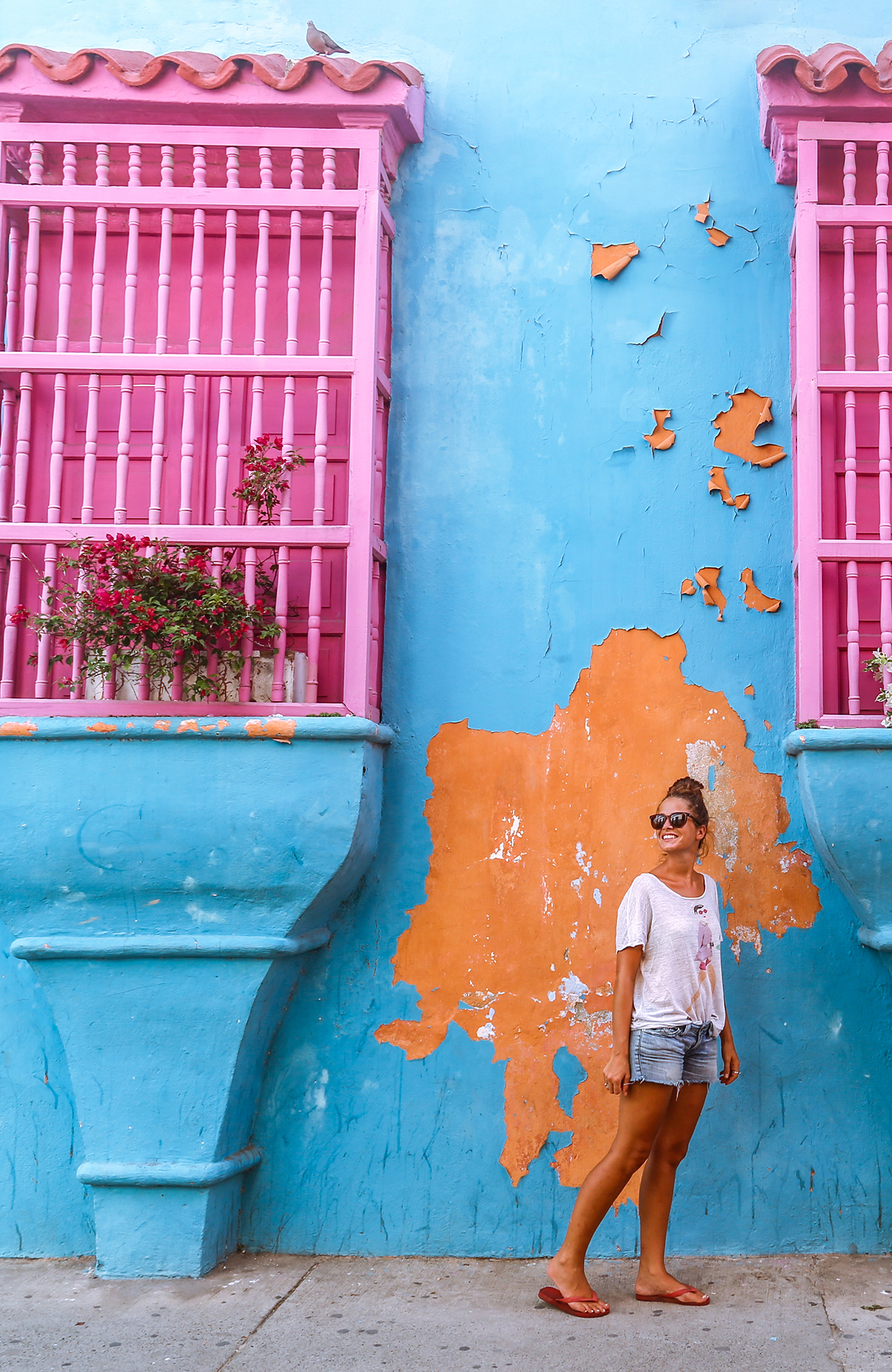 cartagena-colombia-girl-in-front-of-blue-wall-sidebar