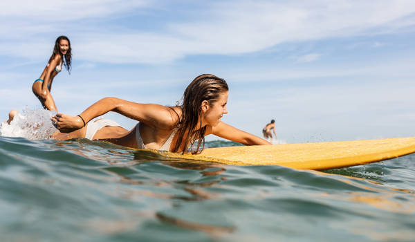 surfing-two-women-small-wave-cover