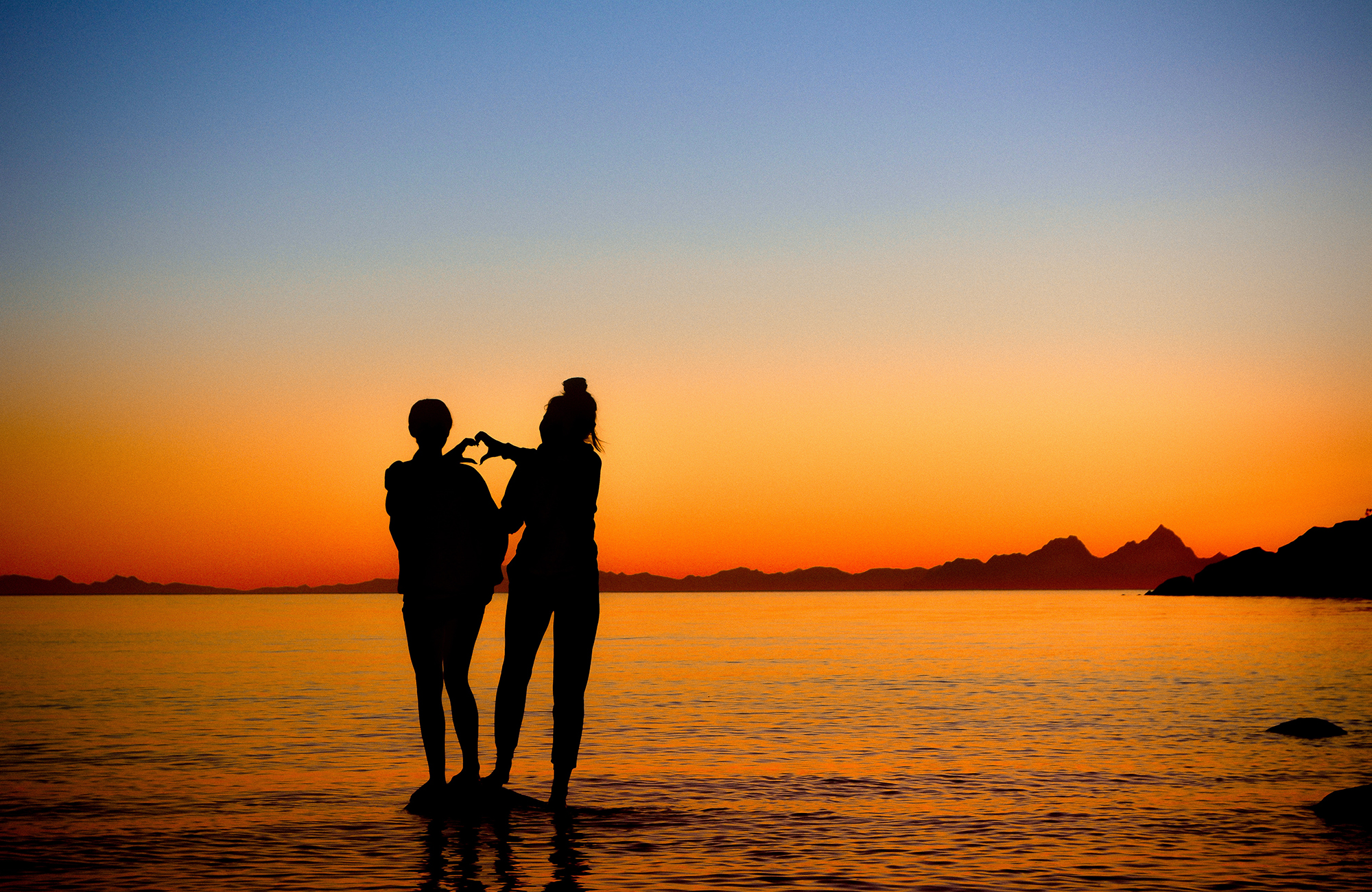 friends-making-heart-at-sunset-cover