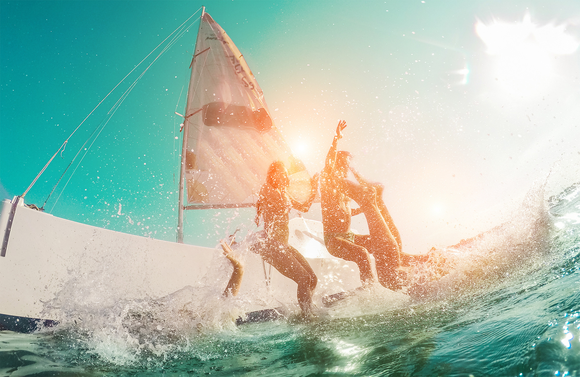 general-inspirational-young-friends-diving-sailboat