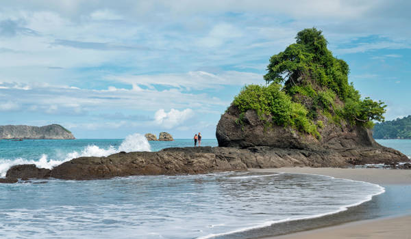 manuel-antonio-costa-rica-beach-and-two-persons-on-rock-cover