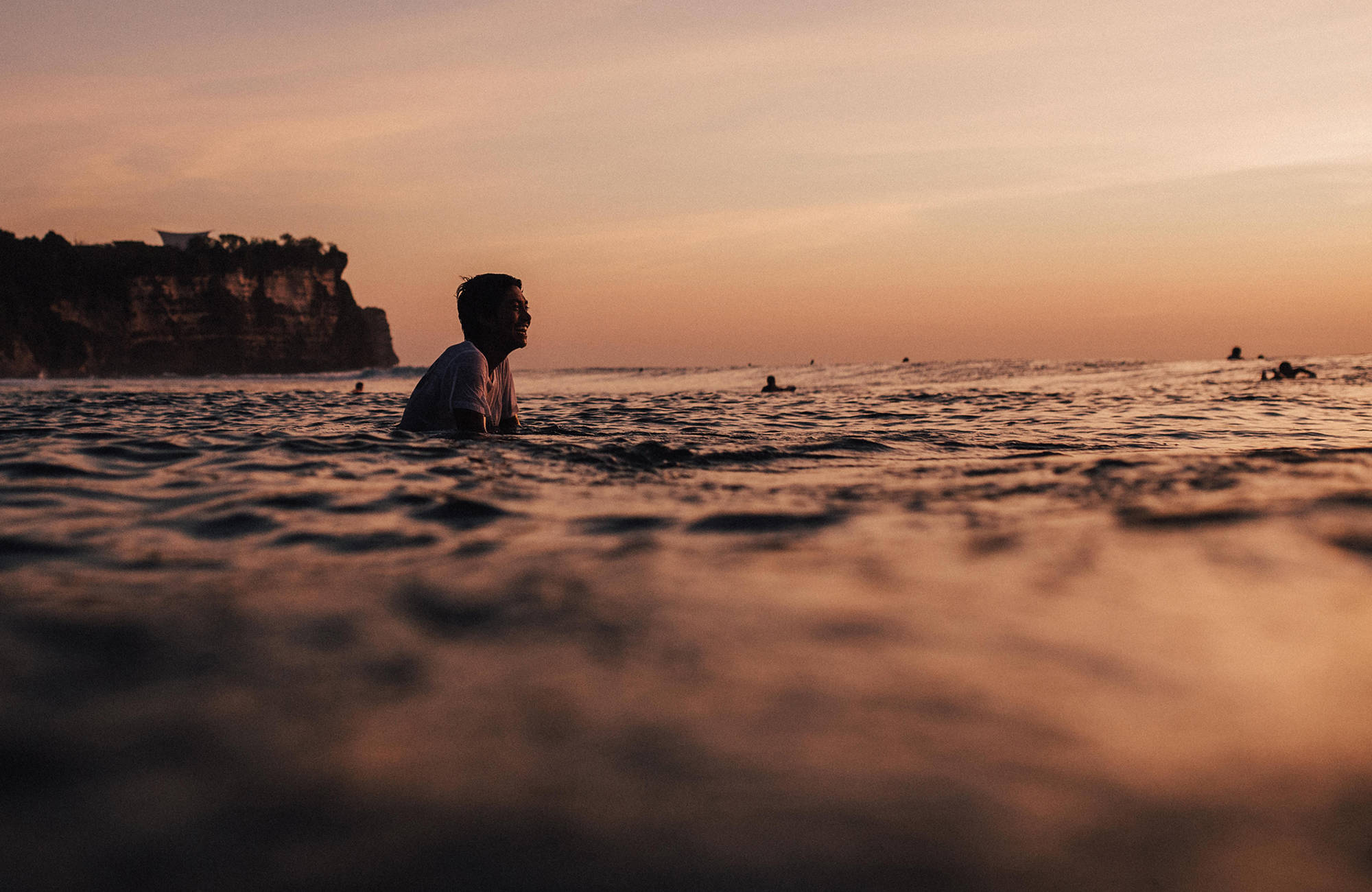 indonesia-bali-uluwatu-surfer-in-the-water-cover