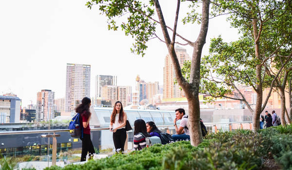 Students Walking Near Water And Campus Of University Of Tecnhology Sydney