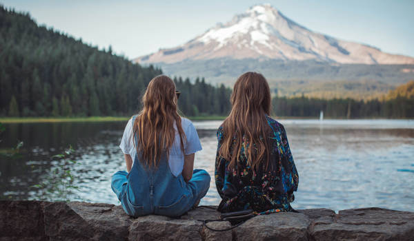Insiprational Two Girls Watching View Over Lake And Mountain Cover