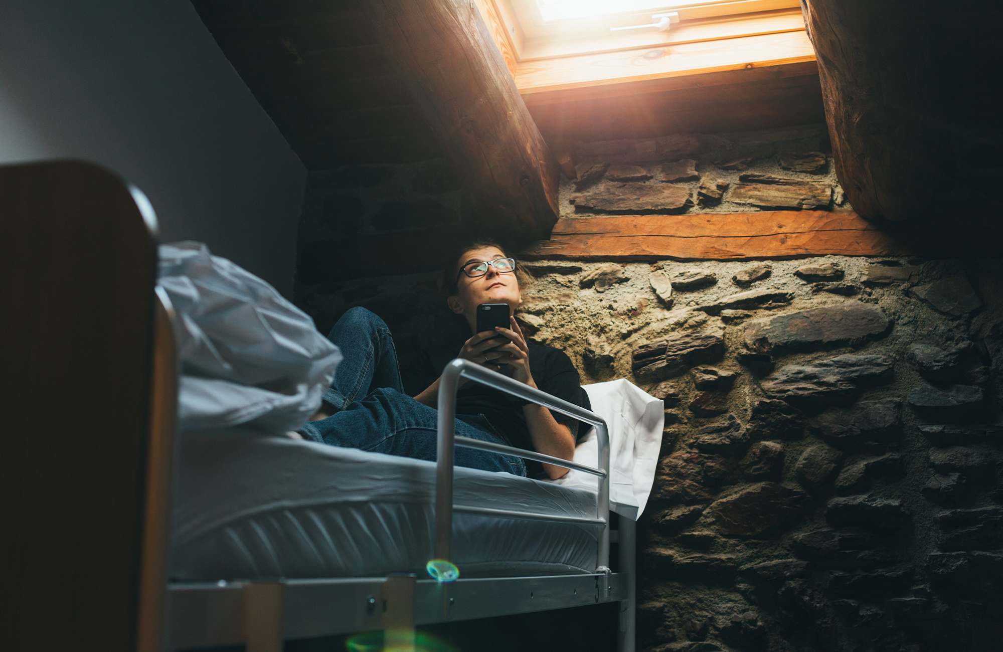 girl in bunkbed with phone