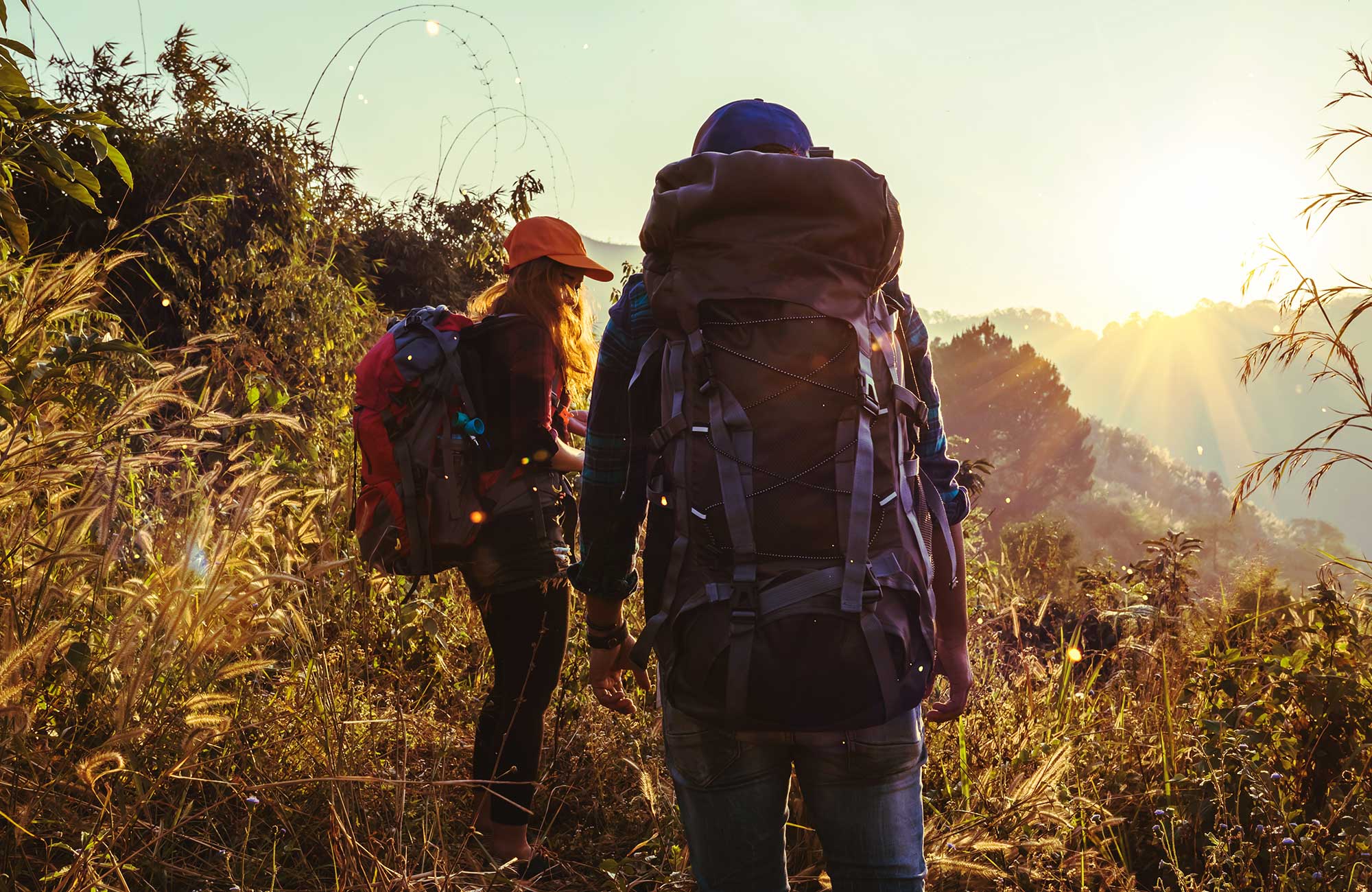 backpackers on field