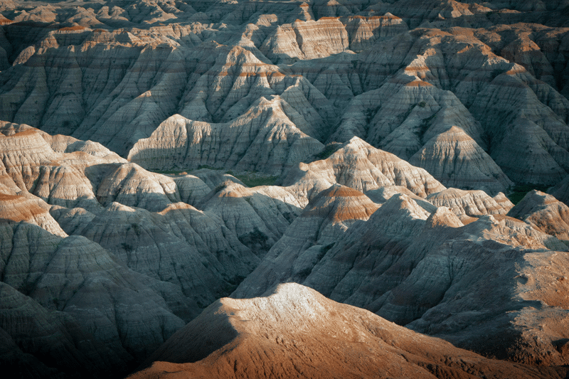 Rocky landscapes in grey and brown of the Badlands National Park in South Dakota