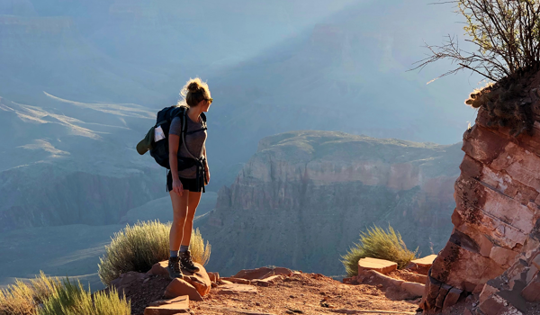 Girl Trekking With Backpack During Sunset (1)