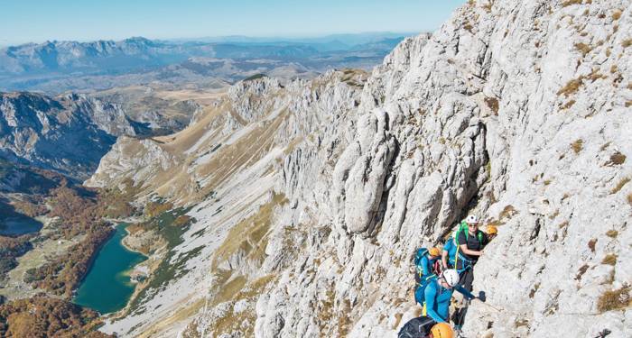 A group of people climbing to Bobotov Kuk in Montenegro